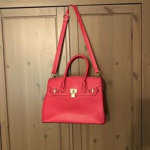 Pink handbag with gold accents
